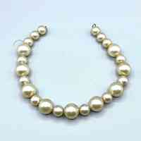 Strand of imitation-pearl (plastic) beads — necklace, clasp absent