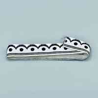 Woven ribbon trim, black-and-white scallop-and-dot pattern
