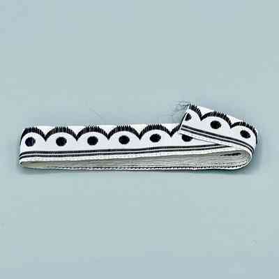Woven ribbon trim, black-and-white scallop-and-dot pattern