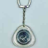 Keychain with clear plastic fob enclosing a goat emblem