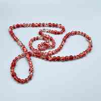 Long beaded necklace of red-and-clear glass beads (reassembled)