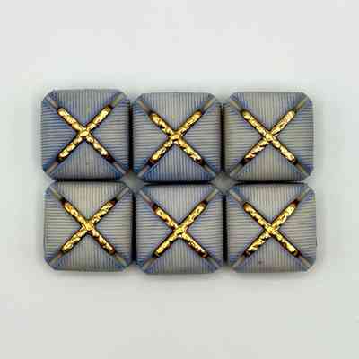 Set of six matching square buttons, blue with golden "X" motif