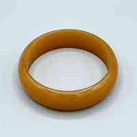 Bangle bracelet, butterscotch/amber plastic (Jablonec)