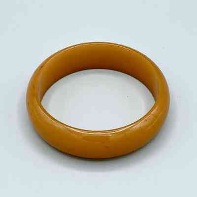 Bangle bracelet, butterscotch/amber plastic (Jablonec)