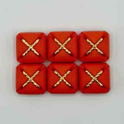 Set of six matching square buttons, red with golden "X" motif