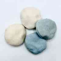 Set of four unused cosmetic powder puffs (off white and pale blue)