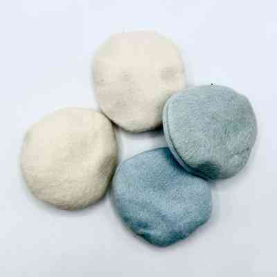 Set of four unused cosmetic powder puffs (off white and pale blue)