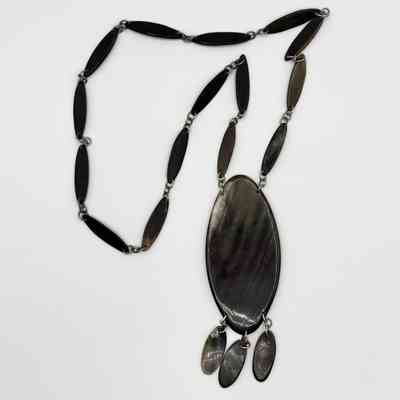 Horn necklace with linked navette plaques and oval pendant
