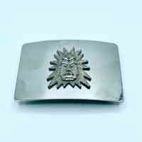 Belt buckle, artisanal, with radiant sun-face (mask) appliqué