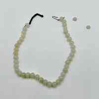 Single-strand bead necklace of pale translucent beads