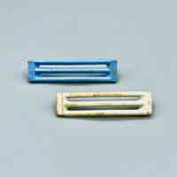 Pair of barrette clip-bodies (arched slotted bars, hinge pin/spring missing)