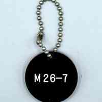 Double-sided "M 26-7" keychain fob (Movimiento 26 de Julio)