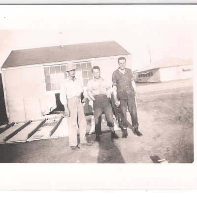 Men standing in front of building