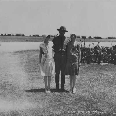 Man in Uniform with 2 women