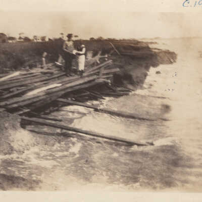 2 people standing on boards