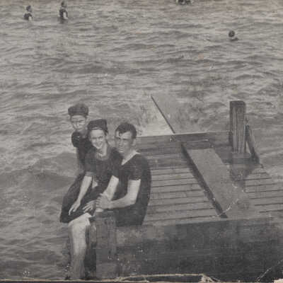 Kids sitting on pier