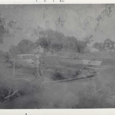 Man hooking boat up to car