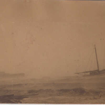 Pavilion & sailboat during storm, post card