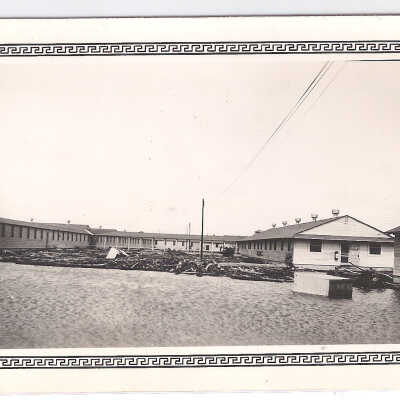 Debris and water in front of structures