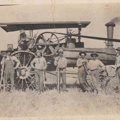 Men standing in front of equipment
