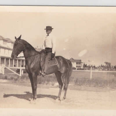 Man on horse by Hotel Palacios