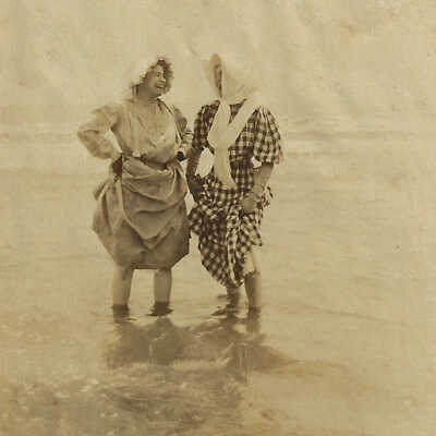 Two Women standing in water