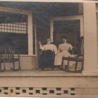 Two Women sitting on Front Porch