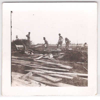 Men searching and cleaning up debris