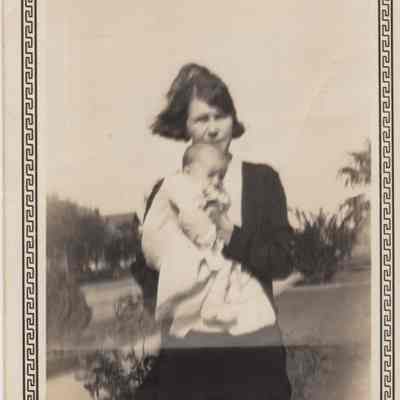 Elsie holding one of her children (Buddy?)
