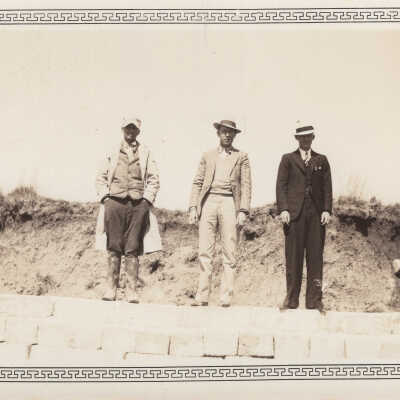 Men standing on constructed seawall