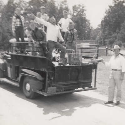 Group of Boys standing in bed of pick-up
