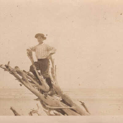 Boy on Driftwood