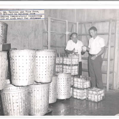 Pres. Ed. Collins and Vice Pres., Cliff Elliott inspecting crab meat
