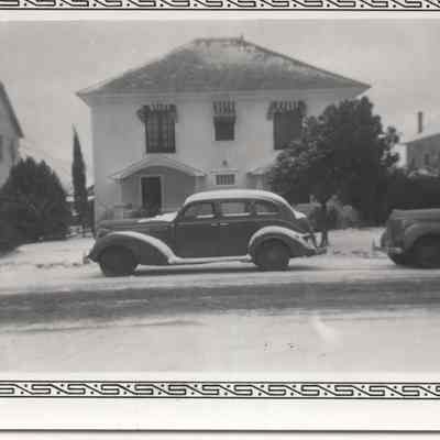 Snowy House w/ a car in front