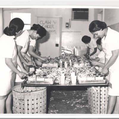 Women packaging crab meat