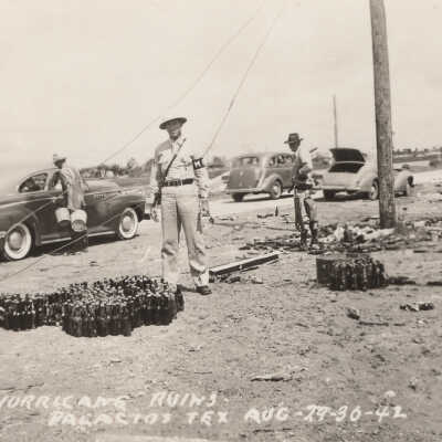 Military Police standing in front of glass bottles