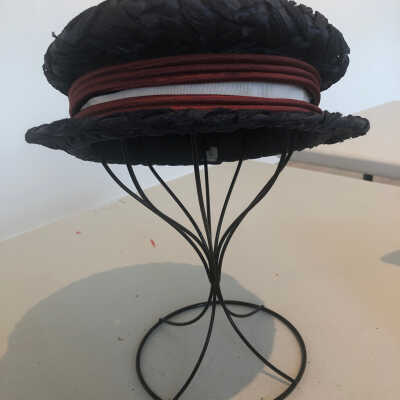 Navy Straw Hat with an Red and White Ribbon
