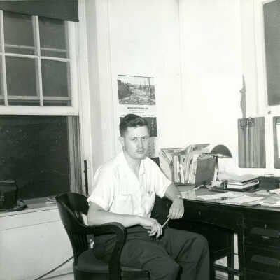 Herb Adelman, president of Crowell Tape Company at desk, 1953