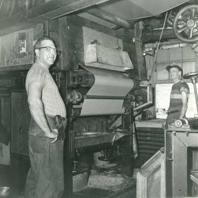 Watson Foote and George Pugh operating the Crowell Tape Mill gummer machine