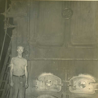 Carl Roberts operating the Crowell Tape Mill coal-powered boiler