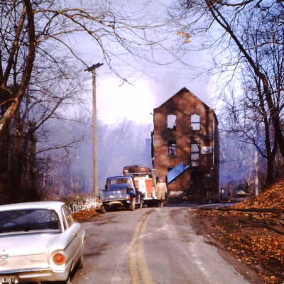 Crowell Tape main building after fire taken from Route 82, 1964