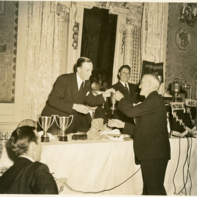 1949 Glidden Tour - T Clarence Marshall, Sr., accepting first-place award at banquet at Hotel DuPont, Wilmington, DE