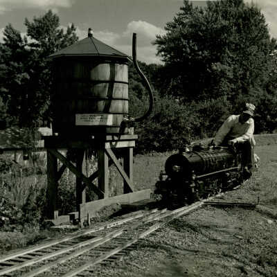 Magic Age of Steam train at the water tower, 1961