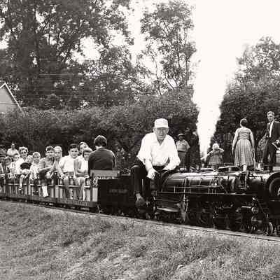 T Clarence Marshall and passengers leaving West Yorklyn station, 1960s