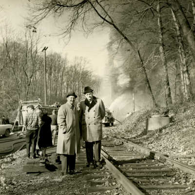 Herb Adelman and his insurance agent at the Crowell Tape Mill fire, 1964