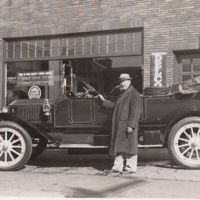 1951 Glidden Tour - J Homer Kratz standing next to 1914 Stanley Model 87 in Wilkes-Barre, PA, 1951