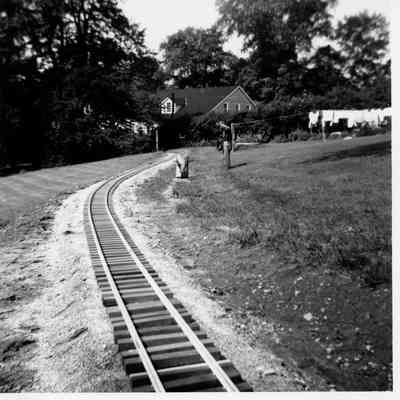 Completed track looking towards the rose arbor and museum from the front lawn, 1960
