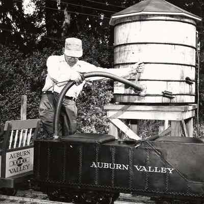 T Clarence Marshall filling the tender, 1960