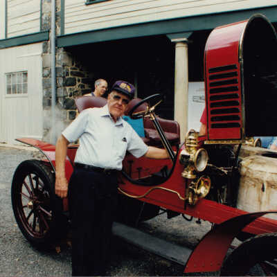 Thomas C Marshall Jr with the 1908 Stanley Model H5 at Hagley Museum, 1997