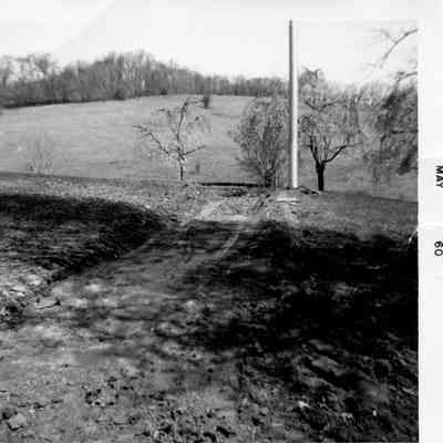 Preparing the grade for the right-of-way in front of the mansion, 1960